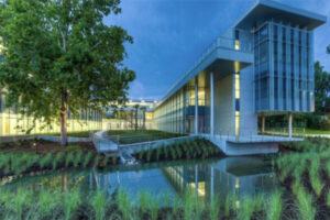 Precast Concrete Building in green grounds with water feature